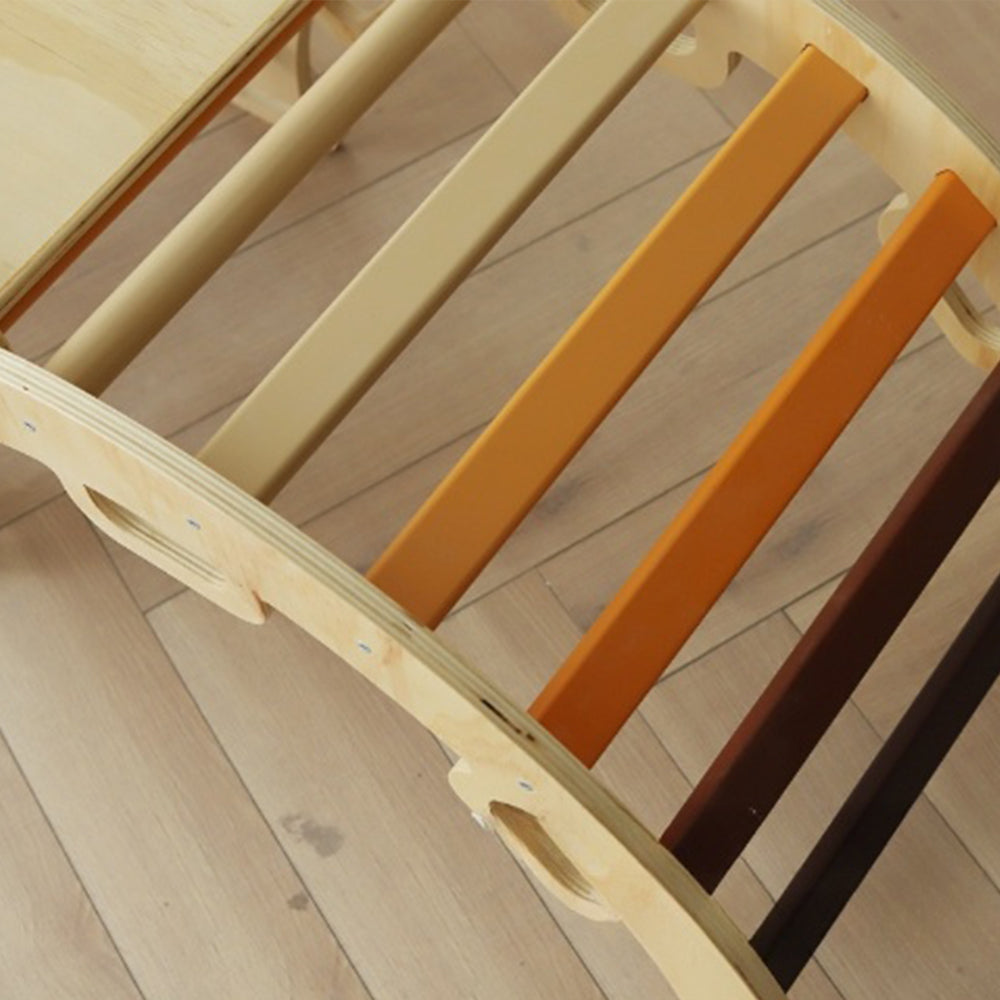 Montessori climbing triangle set with earth-tone rungs and wooden arch in natural colors