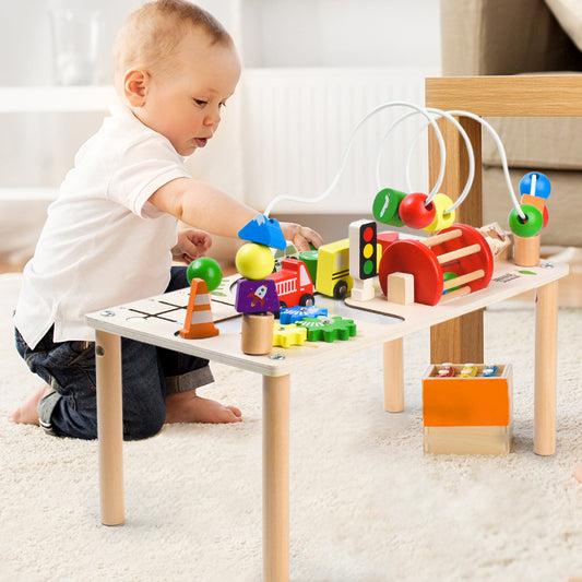 Toddler playing with jollychest Montessori Busy Table – Wooden Activity Table with Cars and Beads