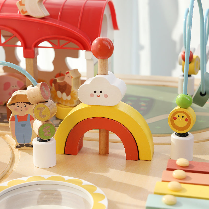 Colorful xylophone and rainbow arch on toddler busy table – jollychest